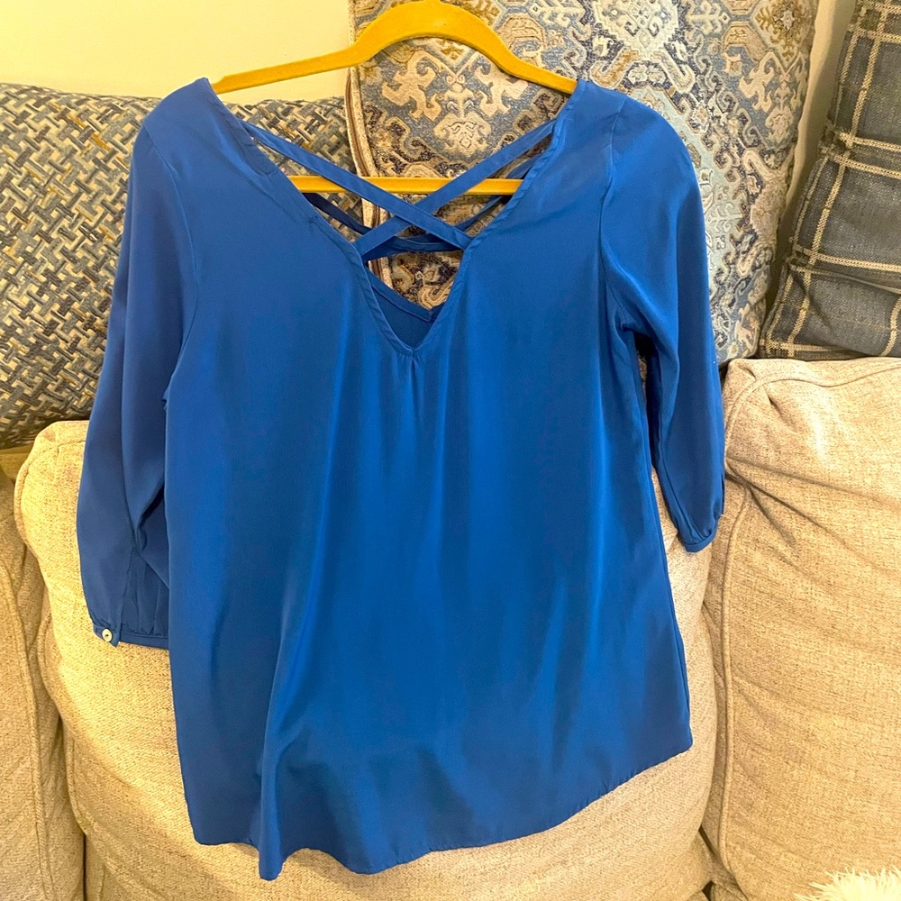Only worn once blue top with Cris-crossed back